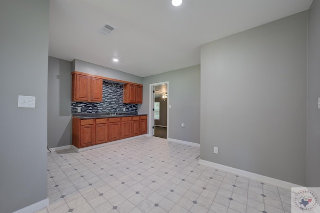 kitchen with sink and backsplash