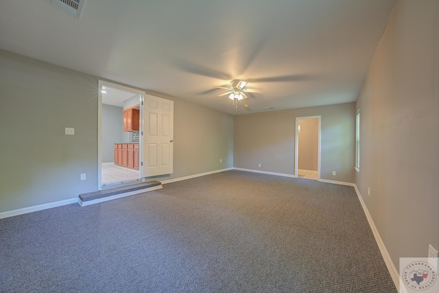 spare room with ceiling fan and carpet floors