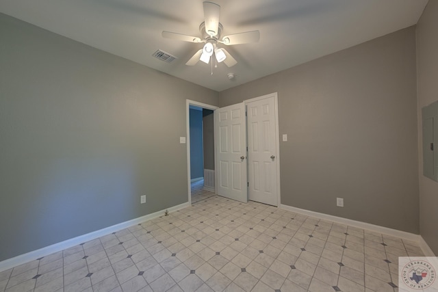 unfurnished bedroom with ceiling fan and a closet