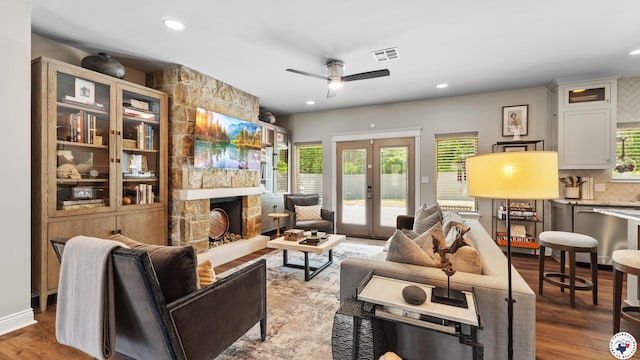 6917 Woodmere Ct, Texarkana, TX 75503 - living area featuring ceiling fan, wood finished floors, recessed lighting, french doors, and a fireplace