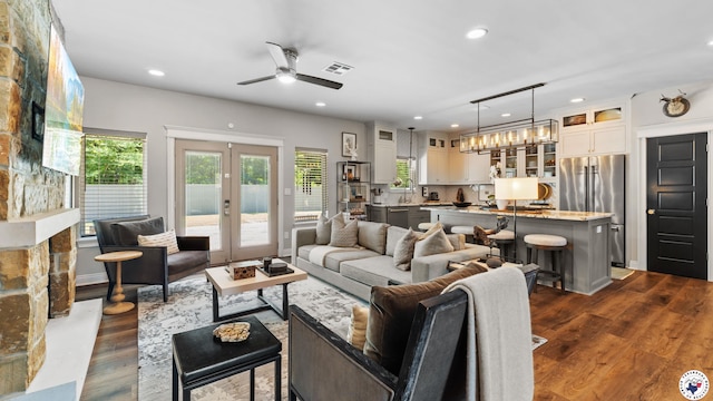 6917 Woodmere Ct, Texarkana, TX 75503 - living area featuring ceiling fan, plenty of natural light, dark wood-type flooring, recessed lighting, and french doors