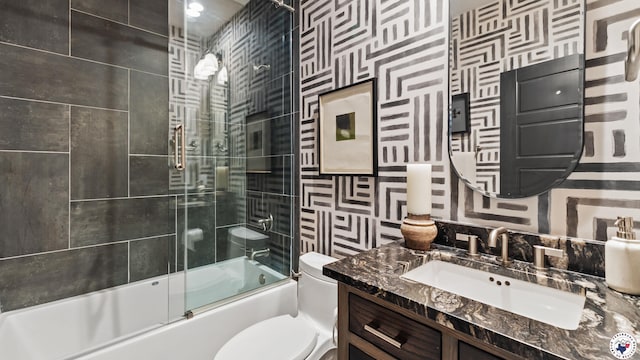 6917 Woodmere Ct, Texarkana, TX 75503 - bathroom with vanity, bath / shower combo with glass door, and toilet