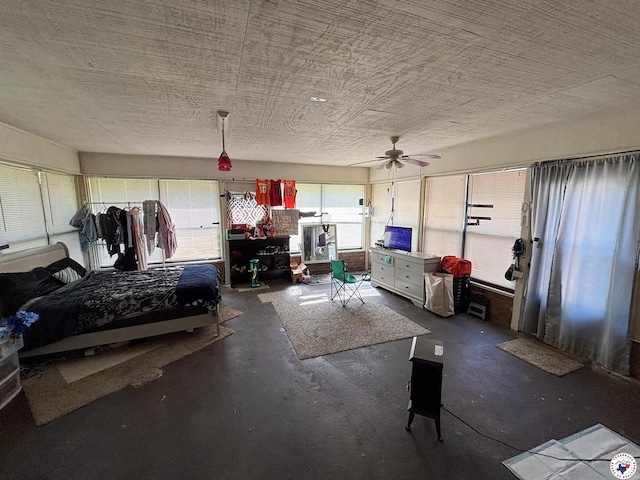 608 N Ellis St, New Boston, TX 75570 - bedroom with concrete floors and a ceiling fan