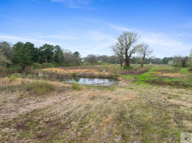 exterior space with a water view and a rural view