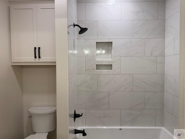 bathroom with shower / bath combination and toilet