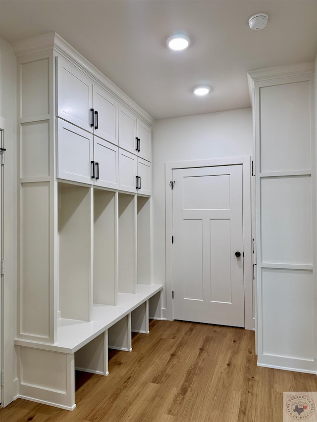 mudroom with light wood-style floors