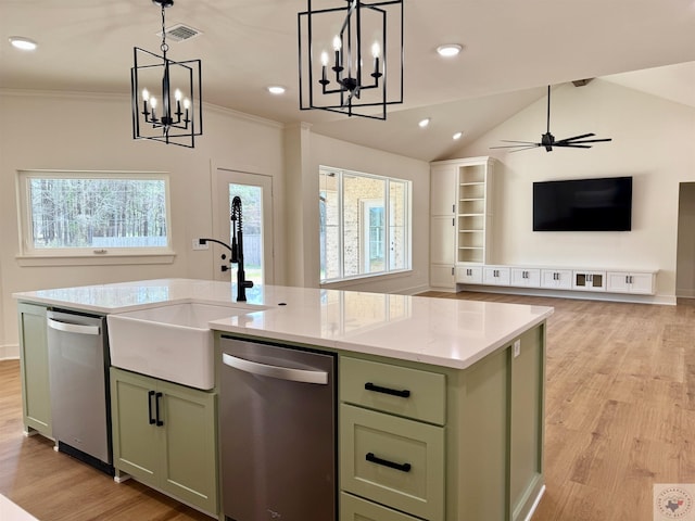 kitchen featuring stainless steel dishwasher, visible vents, a sink, and green cabinets