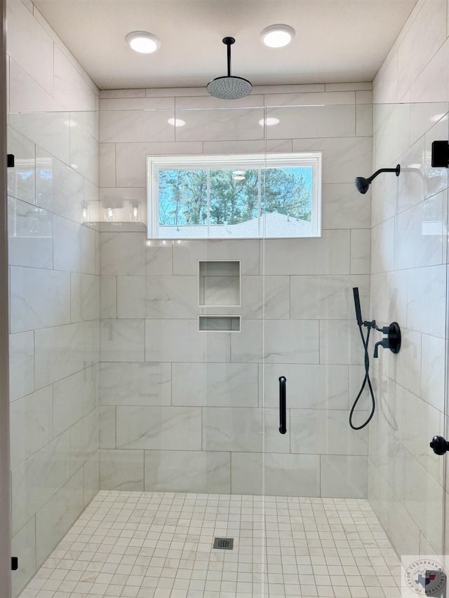 full bath featuring a shower stall