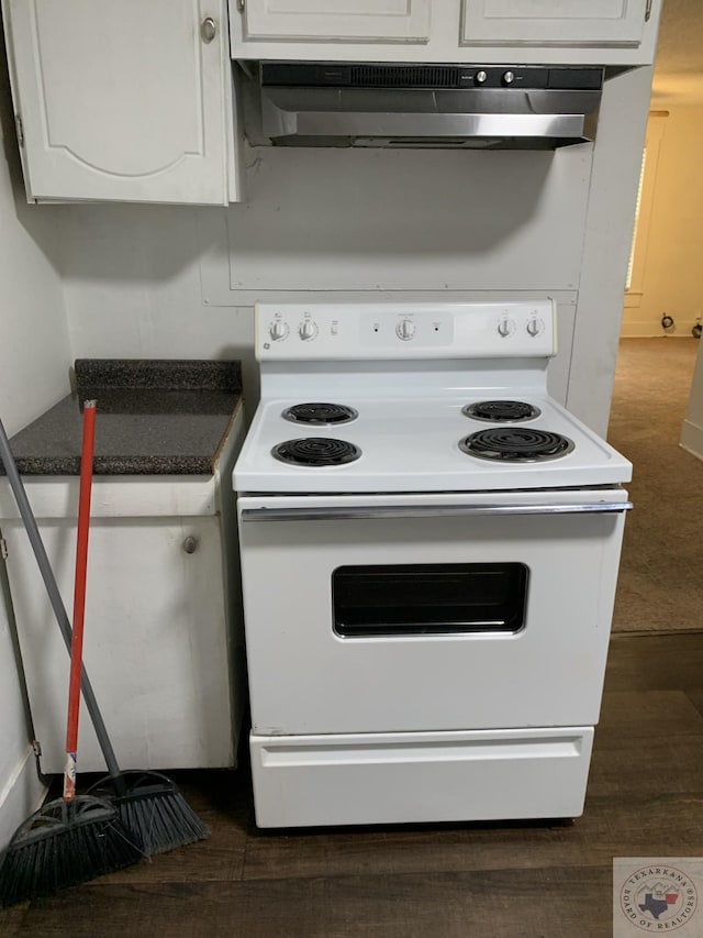 kitchen with white cabinets, dark hardwood / wood-style floors, and white range with electric cooktop