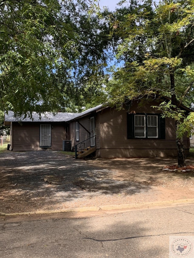 ranch-style house with central AC