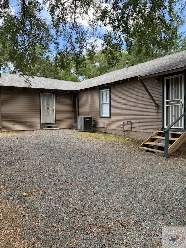 view of front of house featuring central air condition unit