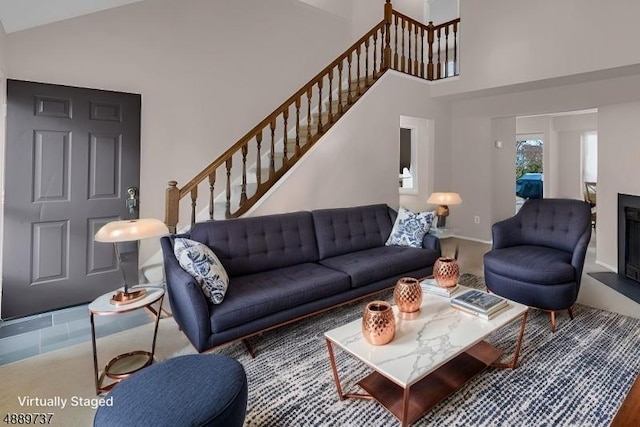 living room with high vaulted ceiling