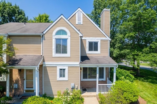 160 Stratford Ct, Hillsborough Twp, NJ 08844 - view of front facade with a chimney, brick siding, a porch, and roof with shingles