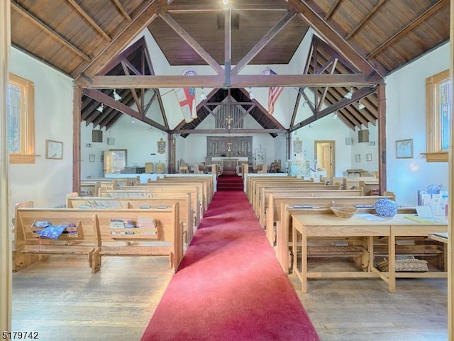 interior space with high vaulted ceiling, dark hardwood / wood-style floors, beam ceiling, and wood ceiling