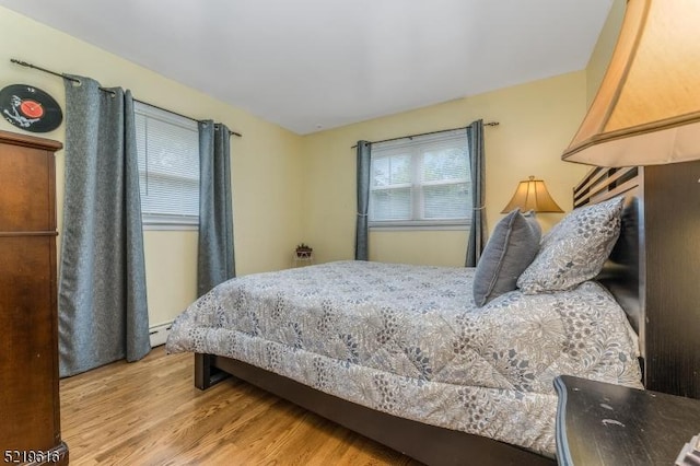 740 Mountain Ave, Bridgewater Twp, NJ 08805 - bedroom with light wood finished floors and a baseboard radiator