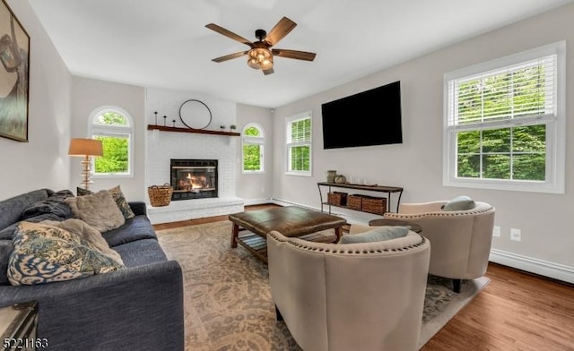 18 Cider Mill Ln, Washington Twp, NJ 07865 - living room with healthy amount of natural light, ceiling fan, wood finished floors, and a brick fireplace