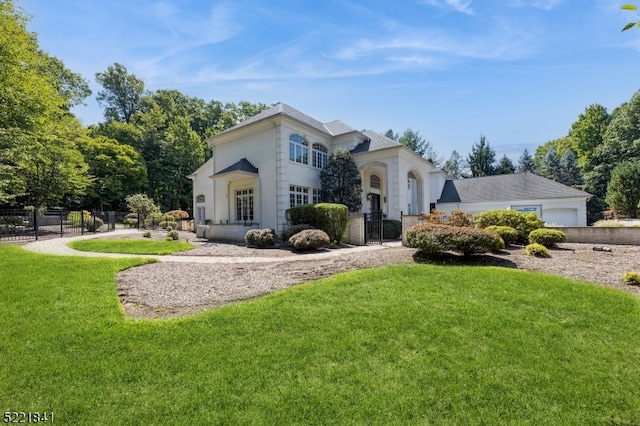 mediterranean / spanish-style home featuring a front lawn