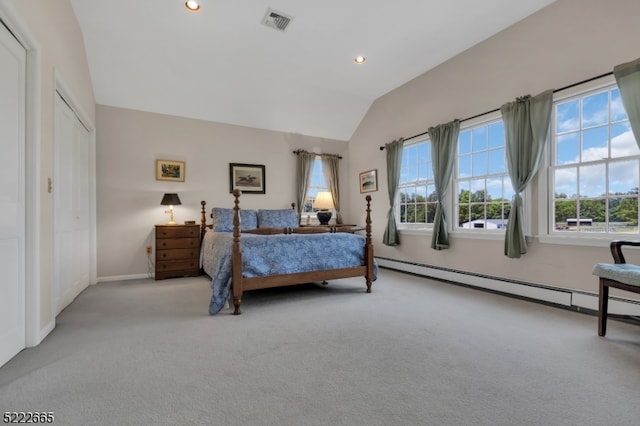 bedroom featuring light carpet and vaulted ceiling