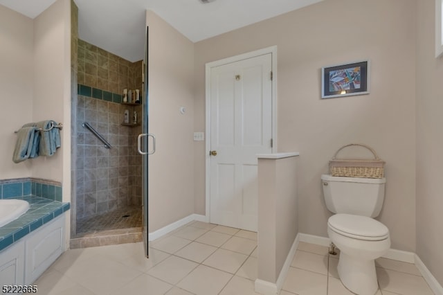 bathroom with walk in shower, tile floors, and toilet