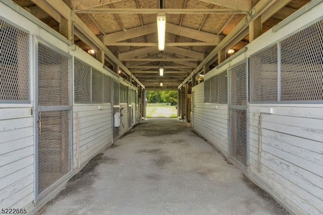 view of horse barn with an outdoor structure