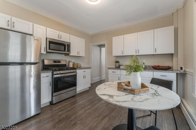 kitchen with baseboard heating, white cabinets, and stainless steel appliances