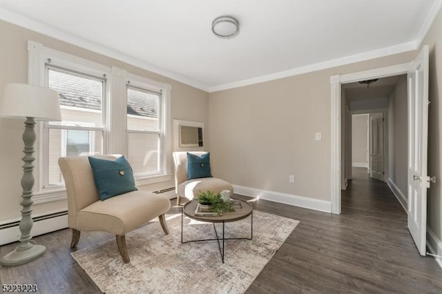 living area with dark wood-type flooring, baseboards, baseboard heating, and ornamental molding