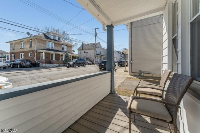 balcony with a residential view and a porch