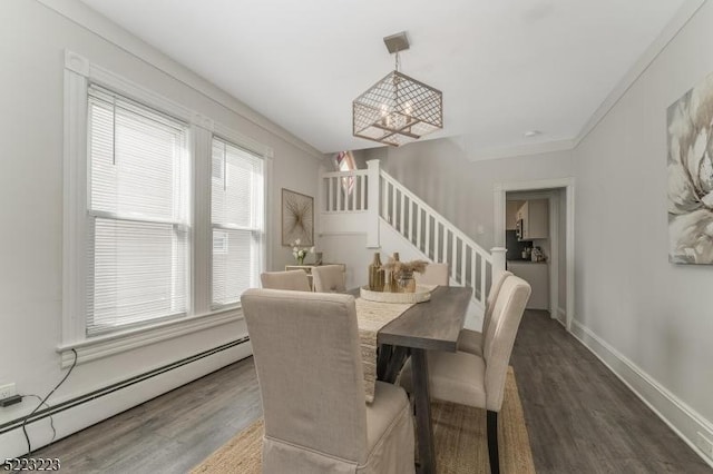 dining area with a baseboard heating unit, baseboards, stairway, an inviting chandelier, and wood finished floors