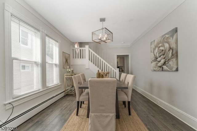 dining area with baseboards, a chandelier, stairs, baseboard heating, and wood finished floors