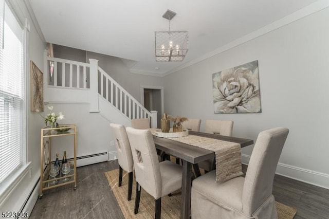 dining area featuring a baseboard heating unit, an inviting chandelier, stairway, and wood finished floors