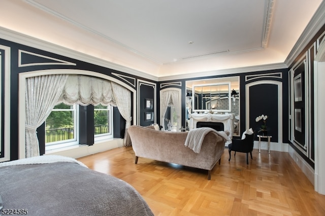 bedroom with crown molding and light parquet flooring