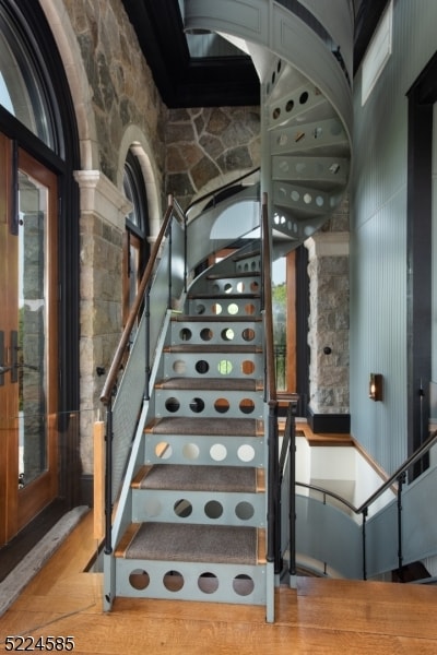 staircase featuring light wood-type flooring