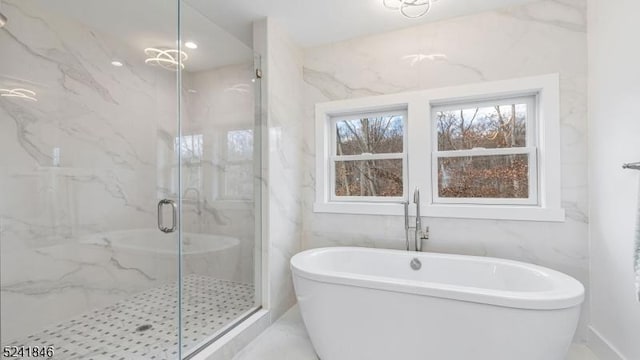 bathroom with shower with separate bathtub