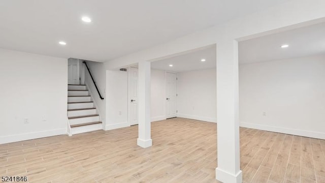 basement featuring light hardwood / wood-style floors