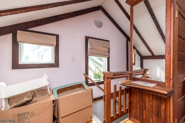 home office with vaulted ceiling with beams