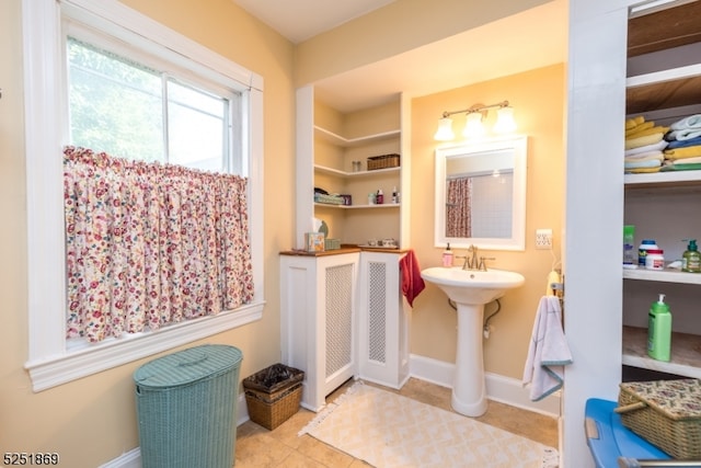 bathroom featuring tile floors