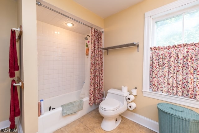 bathroom featuring tile floors, toilet, and shower / bathtub combination with curtain