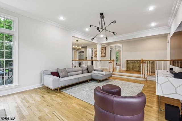 30 Clairvaux Ct, Bernards Twp, NJ 07920 - living area featuring a chandelier, plenty of natural light, crown molding, wood finished floors, and baseboards