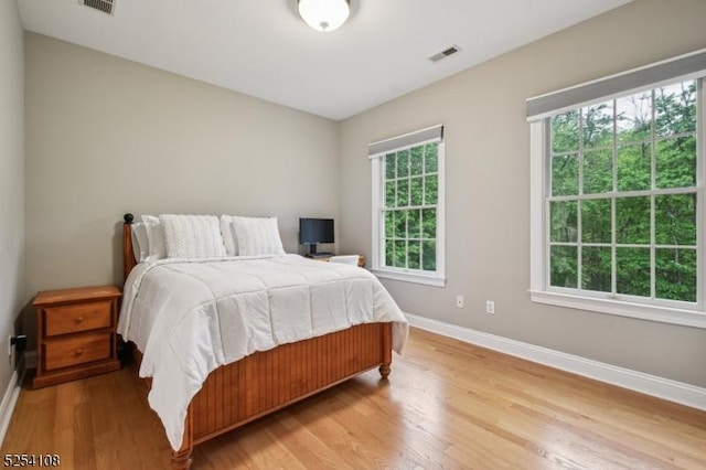 30 Clairvaux Ct, Bernards Twp, NJ 07920 - bedroom with baseboards and light wood-style flooring