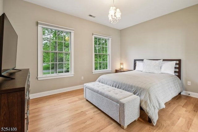30 Clairvaux Ct, Bernards Twp, NJ 07920 - bedroom featuring baseboards, light wood finished floors, and a chandelier