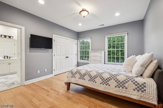 30 Clairvaux Ct, Bernards Twp, NJ 07920 - bedroom featuring wood finished floors, connected bathroom, baseboards, recessed lighting, and a closet