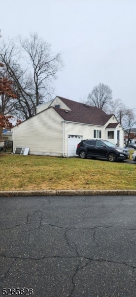 420 Academy Ter, Linden City, NJ 07036 - view of front facade featuring a front yard and a garage