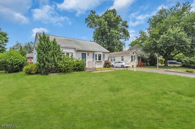 69 Lions Head Blvd, Wayne Twp, NJ 07470 - view of front facade featuring a front lawn and dirt driveway