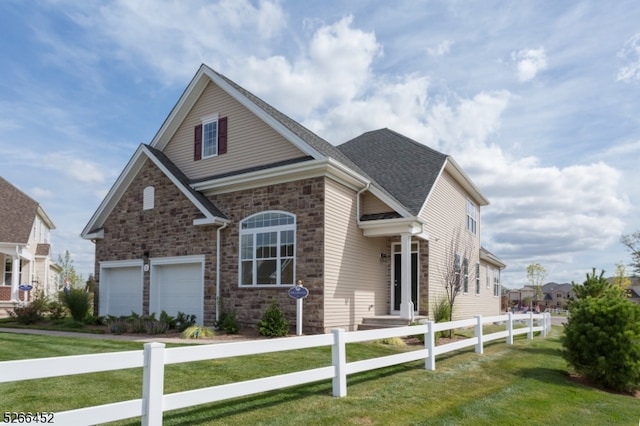 view of front facade featuring a front lawn and a garage