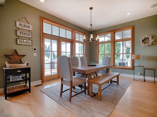201 Lows Hollow Rd, Lopatcong Twp, NJ 08886 - dining room featuring baseboards, a wealth of natural light, light wood-style flooring, and a chandelier