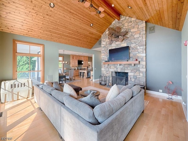 201 Lows Hollow Rd, Lopatcong Twp, NJ 08886 - living room featuring beam ceiling, light wood-style floors, a fireplace, baseboards, and wooden ceiling