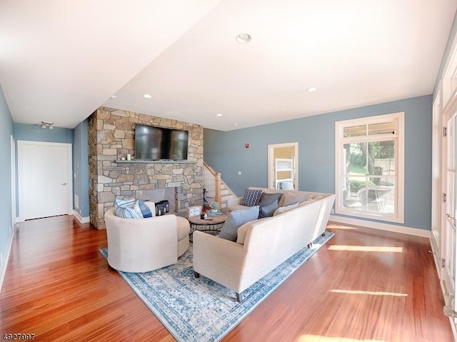 201 Lows Hollow Rd, Lopatcong Twp, NJ 08886 - living area featuring baseboards, stairs, wood finished floors, and a fireplace