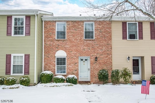 townhome / multi-family property with brick siding