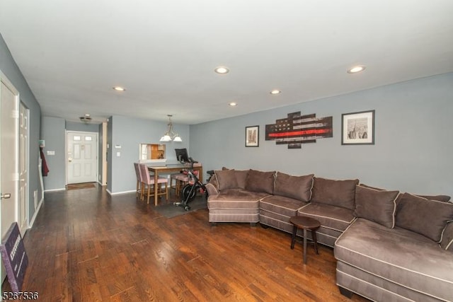 living room featuring an inviting chandelier, wood finished floors, and recessed lighting