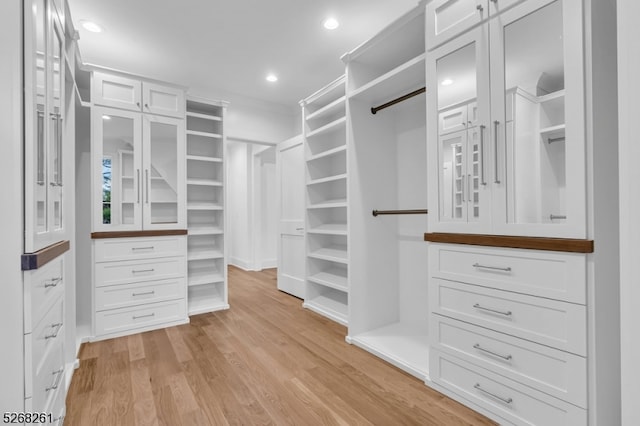 spacious closet featuring light hardwood / wood-style flooring